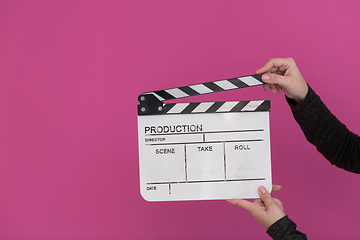 Image showing movie clapper on pink background