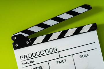 Image showing movie clapper on green  background