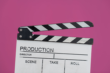 Image showing movie clapper on pink background