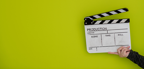 Image showing movie clapper on green  background