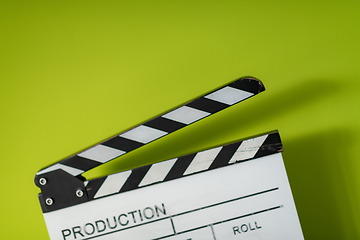 Image showing movie clapper on green  background