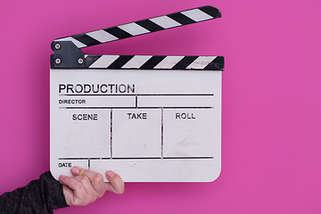 Image showing movie clapper on pink background