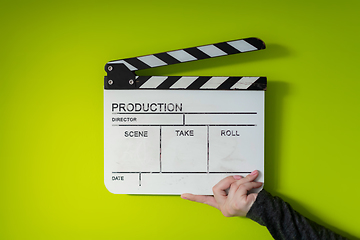 Image showing movie clapper on green  background