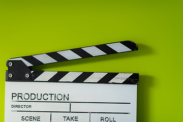 Image showing movie clapper on green  background