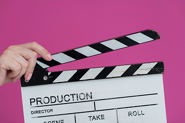 Image showing movie clapper on pink background