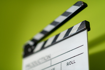 Image showing movie clapper on green  background