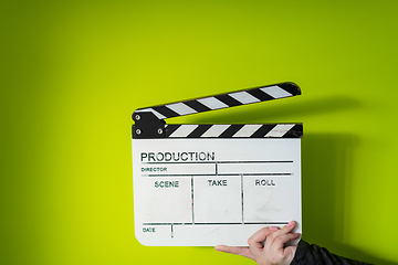 Image showing movie clapper on green  background