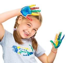 Image showing Portrait of a cute girl playing with paints