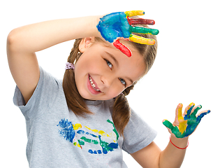 Image showing Portrait of a cute girl playing with paints