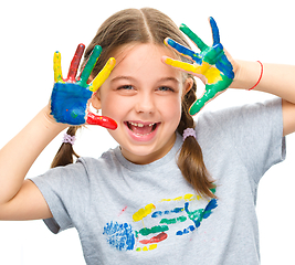 Image showing Portrait of a cute girl playing with paints