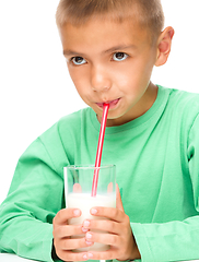 Image showing Cute little boy with a glass of milk