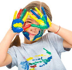 Image showing Portrait of a cute girl playing with paints