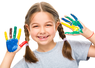 Image showing Portrait of a cute girl playing with paints