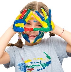 Image showing Portrait of a cute girl playing with paints