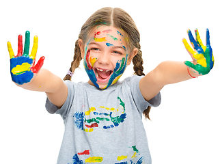 Image showing Portrait of a cute girl playing with paints