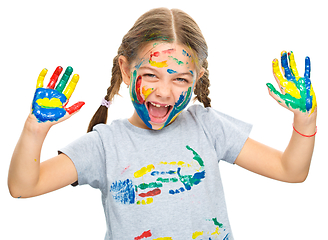 Image showing Portrait of a cute girl playing with paints