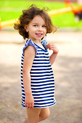 Image showing Cute little girl is playing in playground