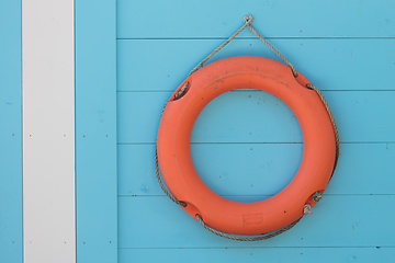 Image showing Red life buoy hanging 