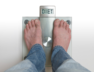 Image showing Man\'s feet on weight scale - Diet