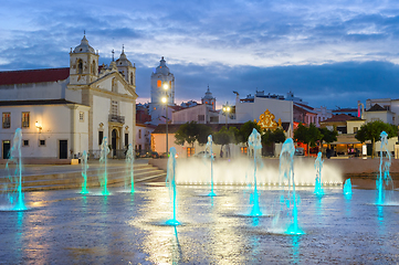 Image showing illuminated Lagos cityscape with fountain