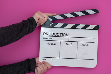 Image showing movie clapper on pink background