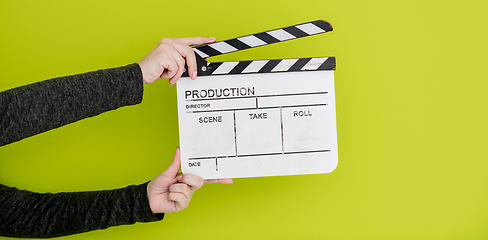 Image showing movie clapper on green  background