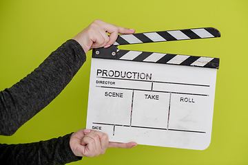 Image showing movie clapper on green  background