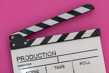 Image showing movie clapper on pink background