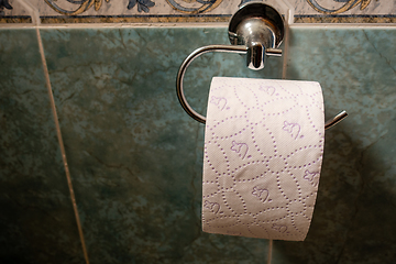 Image showing toilet roll on wall