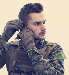 Image showing soldier preparing gear for action