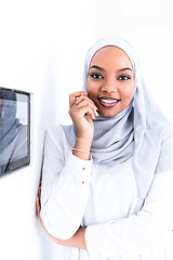 Image showing african woman using smart home screen