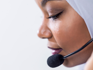Image showing african customer representative business woman with phone headse