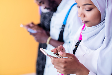 Image showing african students group using smart phones