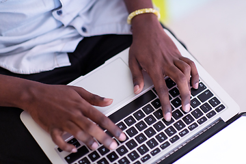 Image showing African student using laptop computer