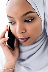 Image showing african business woman using smartphone