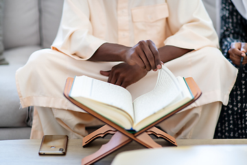 Image showing african couple at home reading quran