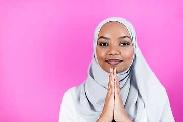 Image showing African Muslim woman makes traditional prayer to God