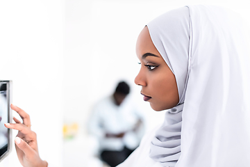 Image showing african woman using smart home screen