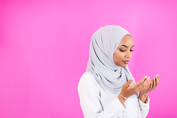 Image showing African Muslim woman makes traditional prayer to God