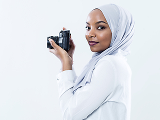 Image showing african modern muslim woman using retro camera