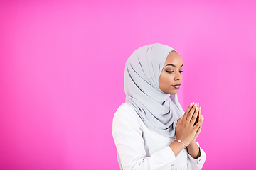 Image showing African Muslim woman makes traditional prayer to God