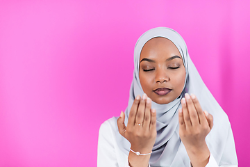 Image showing African Muslim woman makes traditional prayer to God