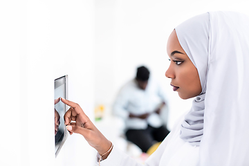 Image showing african woman using smart home screen