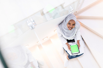 Image showing african  woman using tablet at home