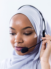 Image showing african customer representative business woman with phone headse