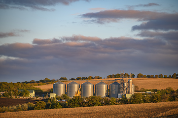 Image showing Grain storage silos, shiny metal tanks for grain at Rogojeni railway station in Moldova