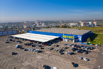 Image showing Metro retail store, large shopping mall of household and food goods with parking, aerial view, copyspace