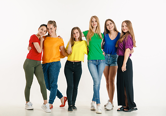 Image showing Young people weared in LGBT flag colors isolated on white background, LGBT pride concept