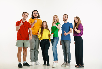 Image showing Young people weared in LGBT flag colors isolated on white background, LGBT pride concept