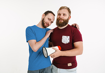 Image showing Young men weared in LGBT flag colors isolated on white background, LGBT pride concept